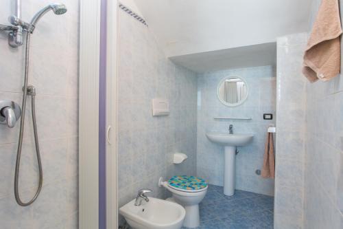 a small bathroom with a toilet and a sink at Villa Calma in Vieste