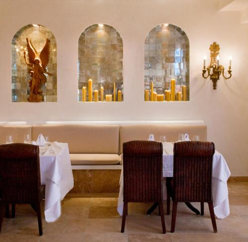 a dining room with a table and some candles at Casa Kimberly Boutique Hotel in Puerto Vallarta