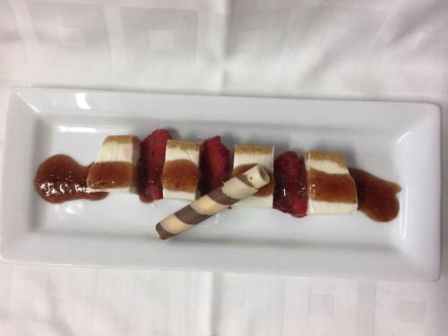 two pieces of food on a white plate at Hotel El Tabanco in El Bosque
