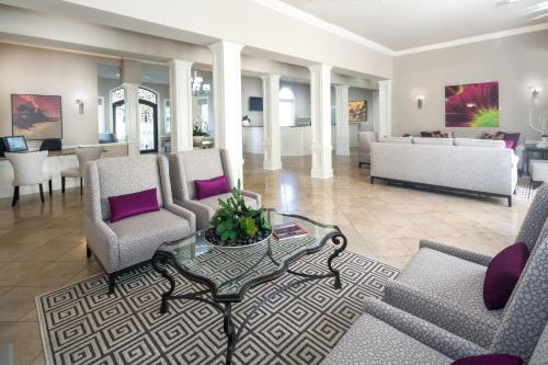 a living room with couches and a table at Club de Soleil All-Suite Resort in Las Vegas