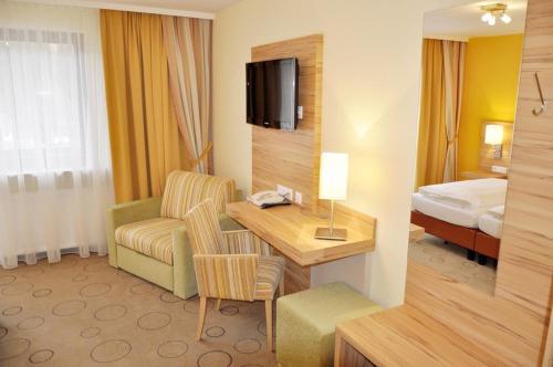 Postel nebo postele na pokoji v ubytování Gasthof Landhotel Hubmann