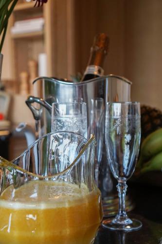 a group of wine glasses sitting on a table at Boutique Hotel De Brakelhoen in Brakel