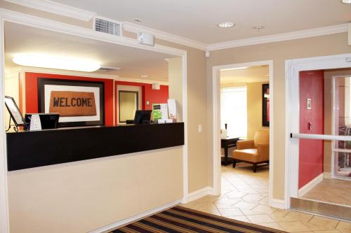 a lobby of a hotel with a welcome counter at Extended Stay America Suites - Kansas City - Overland Park - Nall Ave in Overland Park
