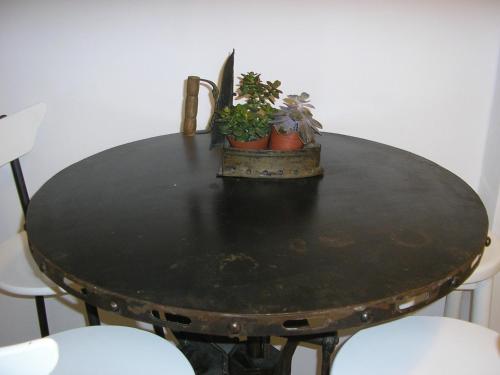 a black table with potted plants on top of it at Apartment Sunrise in Hydra