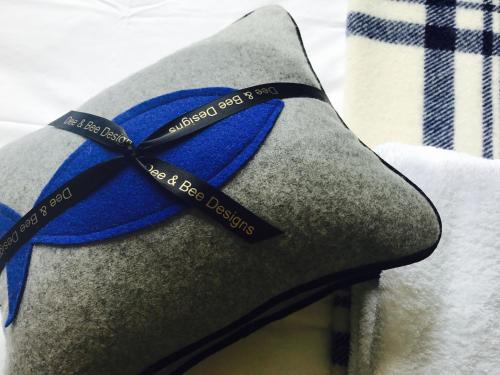 a blue ribbon is tied to a shoe at Sunrise Guest House in Bude