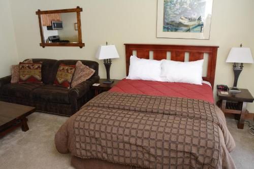 a hotel room with two beds and a lamp at Northstar California Resort in Truckee