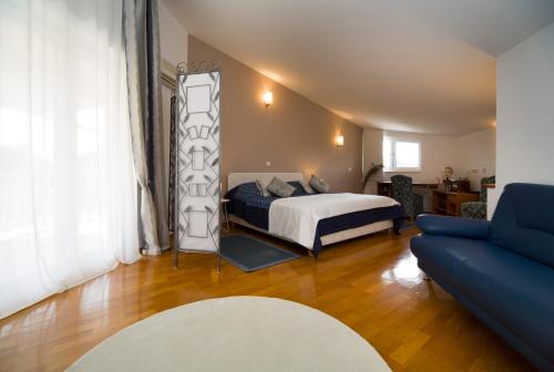 Postel nebo postele na pokoji v ubytování Villa Omnes