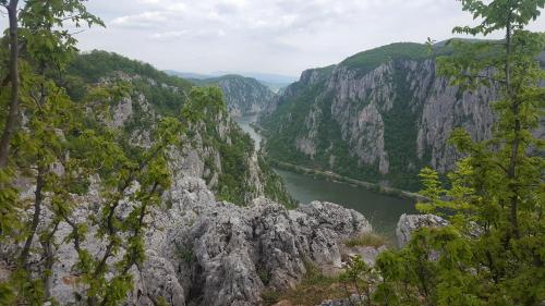 a view of a river between two mountains at Pensiunea Decebal Resort - Cazanele Dunarii in Dubova