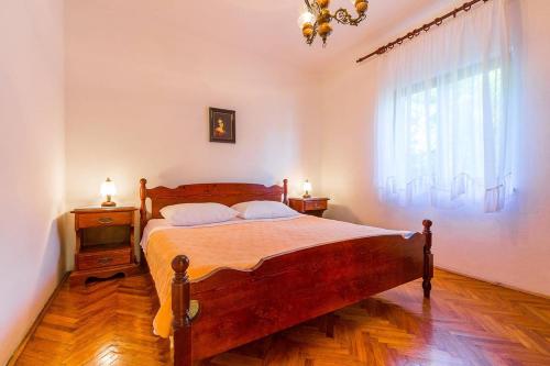 a bedroom with a bed and a large window at Holiday Home Anka in Medulin