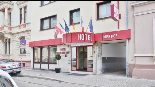 a hotel with flags on the front of a building at City Partner Hotel Berliner Hof in Karlsruhe