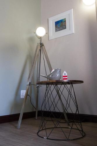 a tripod with a light on top of a table at Little Rock Guesthouse in Jongensfontein