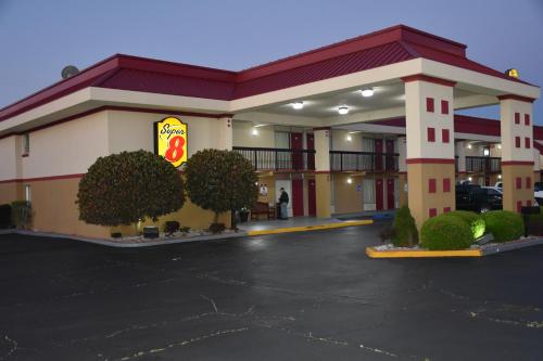 a hotel with a parking lot in front of it at Super 8 by Wyndham Tifton in Tifton