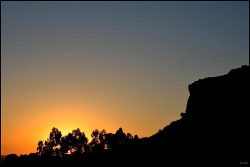 an image of a sunset with trees in the foreground at Cheetau Lodge in Ebenhaezer