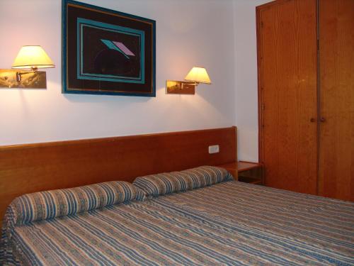 
Cama o camas de una habitación en Apartamentos Sol Isla
