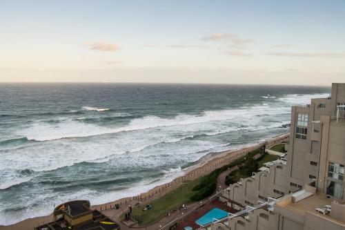 an aerial view of the ocean from a building at 1104 The Bermudas - by Stay in Umhlanga in Durban