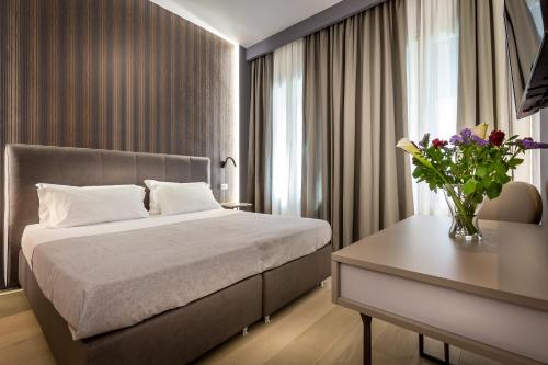 A bed or beds in a room at Blu Notte Guest House