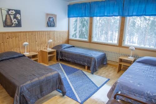 Camping Lappeenranta tesisinde bir odada yatak veya yataklar