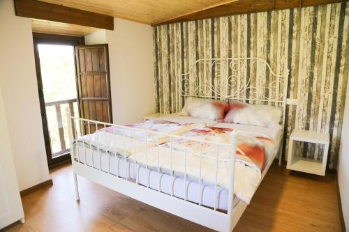 מיטה או מיטות בחדר ב-Casa Juca