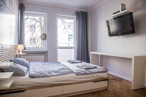 Tempat tidur dalam kamar di Apartament Skwer Kosciuszki Gdynia Parking!!