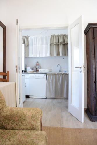 a kitchen with a sink and a counter top at Casa da Paleta in Castelo de Vide
