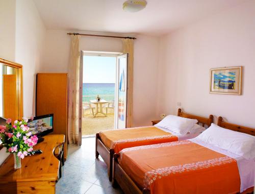 Postel nebo postele na pokoji v ubytování Hotel La Gondola