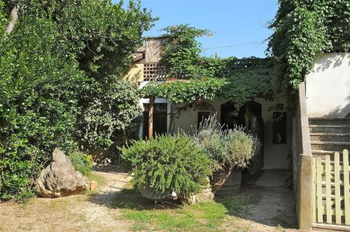 a house with some plants in front of it at Agriturismo "Borgo Madonna degli Angeli" - charming cottages in the gardens ! in Tocco da Casauria