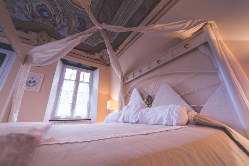 Кровать или кровати в номере Il Sogno Maison de Charme