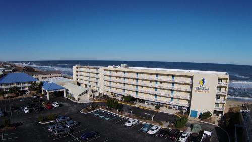 an aerial view of a hotel and the ocean at The Sea Ranch Resort in Kill Devil Hills