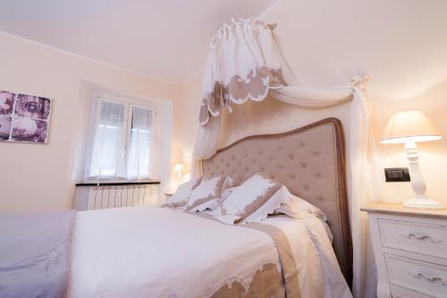 Кровать или кровати в номере Il Sogno Maison de Charme