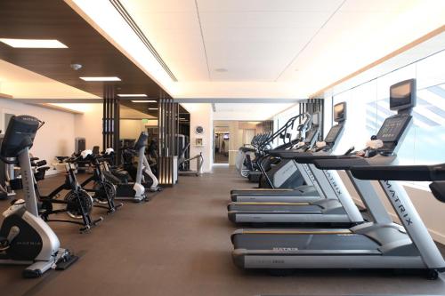 a gym with treadmills and elliptical machines at Four Seasons Hotel Houston in Houston