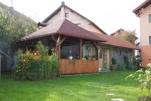 a house with a gazebo in a yard at Guesthouse Relax and Fly Sarajevo in Sarajevo