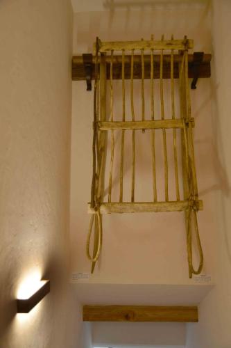 a shelf on a wall with two lights on it at Antico fienile in Belluno