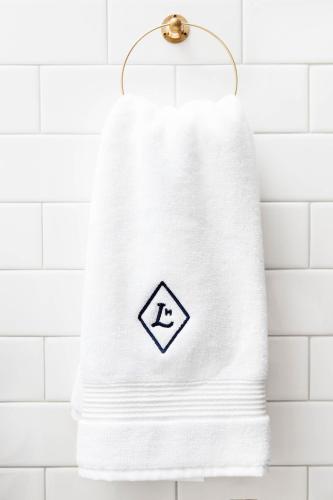 a towel hanging on a towel rack in a bathroom at Lokal Hotel Old City in Philadelphia