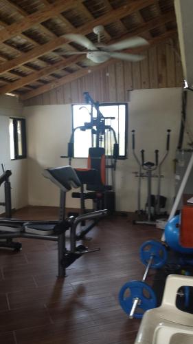 a gym with several exercise equipment in a room at El Cabarete Spa Resort all-Inclusive in Cabarete