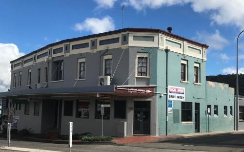 
a building with a sign on the side of it at Commercial Hotel Motel Lithgow in Lithgow

