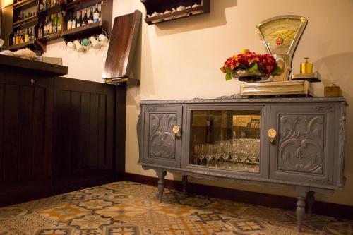 a gray cabinet with a mirror on top of it at Charme e Alegria in Viseu