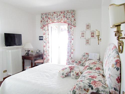 Postel nebo postele na pokoji v ubytování B&B Le Palme
