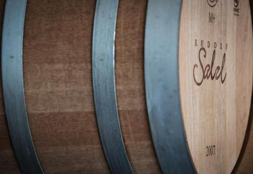 two wooden barrels of wine are next to each other at Weingut und Gästehaus Salzl in Illmitz