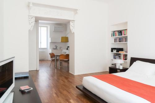 Voodi või voodid majutusasutuse Brera Apartments in San Fermo toas