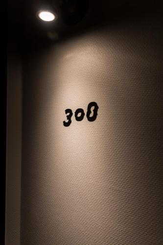 a white wall with the number on it at Hotel Resol Nagoya in Nagoya