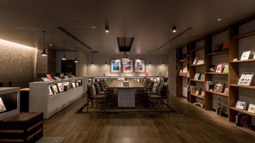 a room with a table and chairs in a book store at Hotel Resol Nagoya in Nagoya