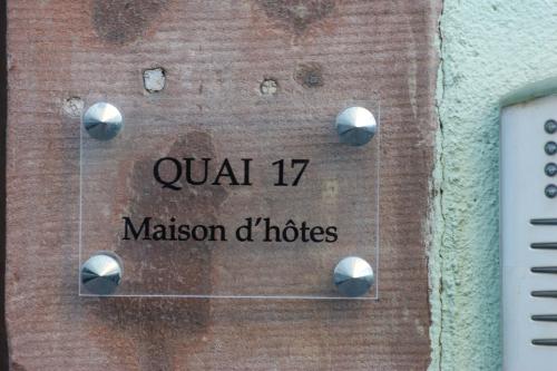 a sign on the side of a building with the words qazi at Quai 17 Maison d'hôtes in Strasbourg