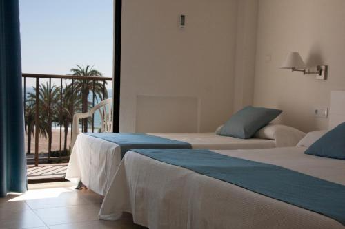 Postel nebo postele na pokoji v ubytování Hotel Sicania