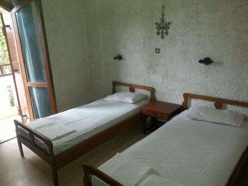 Ένα ή περισσότερα κρεβάτια σε δωμάτιο στο Irene Apartments