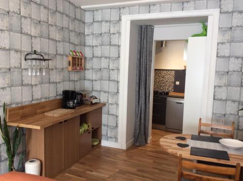 a kitchen with a counter and a dining room at Number 7 Gouarec in Gouarec