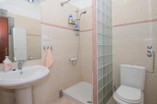 a small bathroom with a sink and a toilet at Stiniva-stone House in Vela Luka
