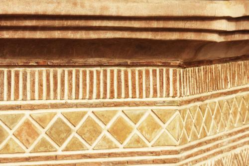 a close up of a wall with patterns on it at Palais d'hôtes Darsor in Marrakech