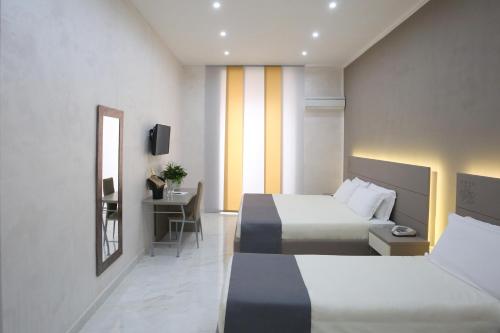 Katil atau katil-katil dalam bilik di Hotel Vergilius Billia