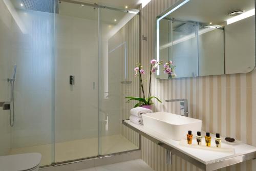 a bathroom with a sink and a shower at Locanda della Posta Boutique Hotel in Perugia