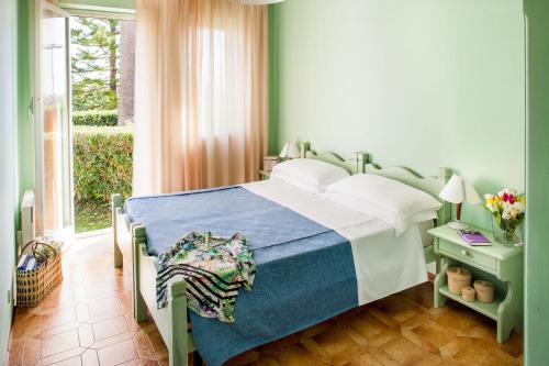 Ένα ή περισσότερα κρεβάτια σε δωμάτιο στο Il Borgo Della Rovere
